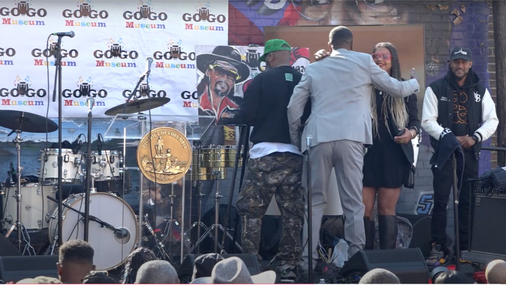 Professor Natalie Hopkinson takes the stage at the Go-Go Museum’s soft opening.