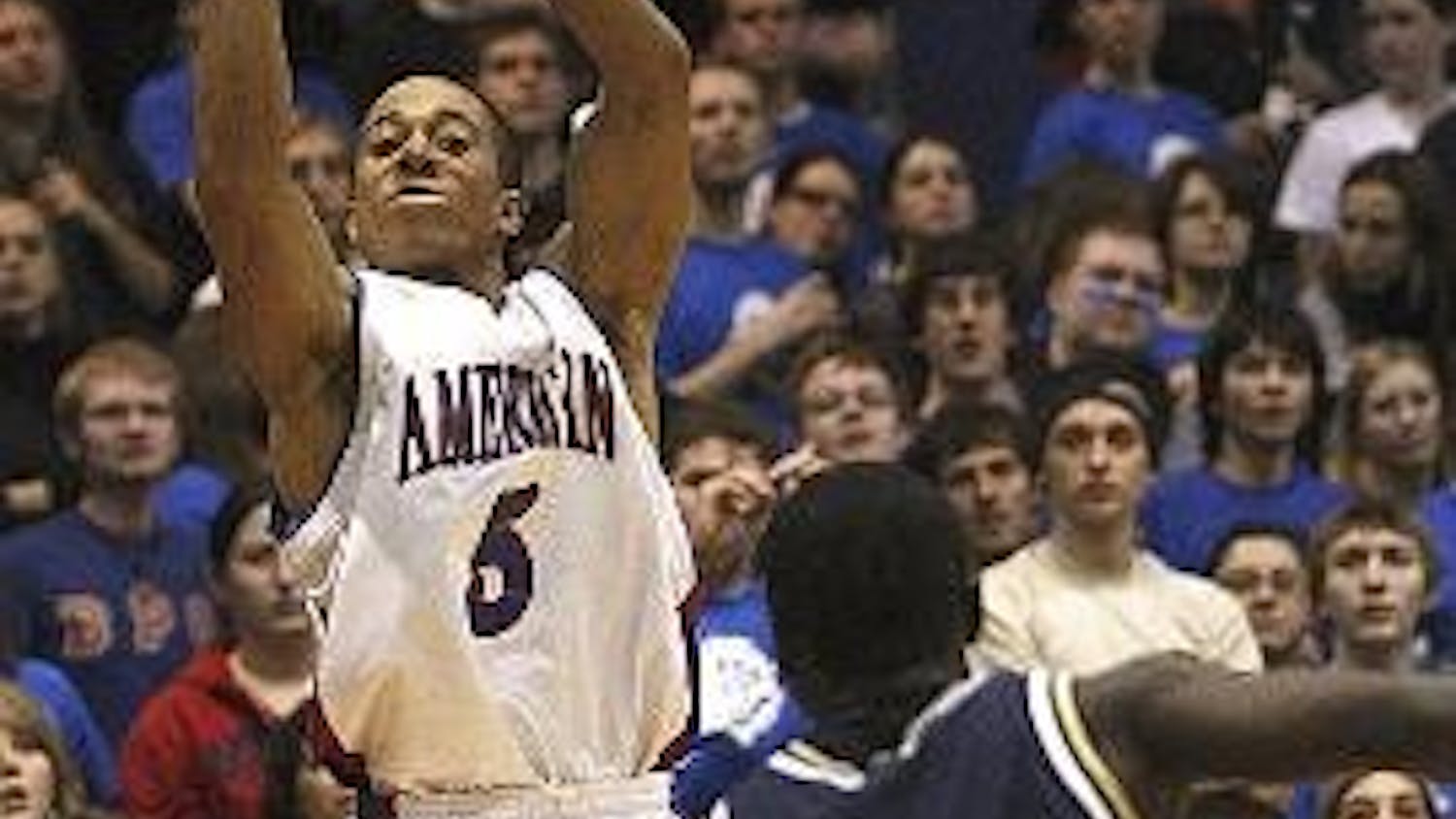 Senior guard Garrison Carr (top) rises up for a jumper while fellow guard Derrick Mercer (bottom) crosses up a Navy opponent during last nights game to clinch the Patriot League regular season title.