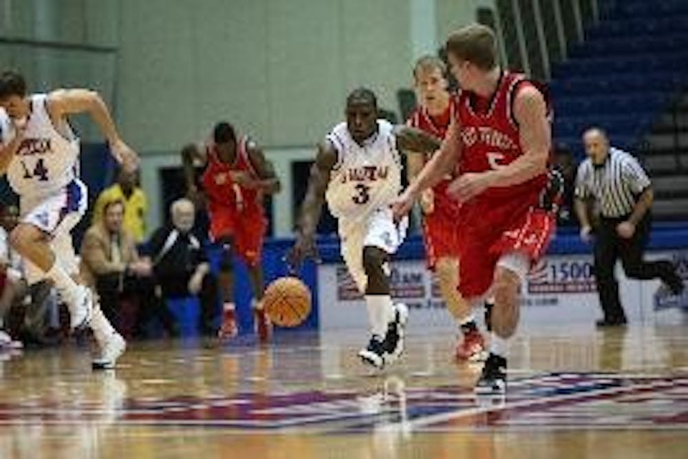 EYES FORWARD - No. 3 senior guard Derrick Mercer leads the charge upcourt in the Eagles recent victory over St. Francis.  Mercer had 10 points to help the Eagles defeat Jacksonville on Saturday, 75-67.