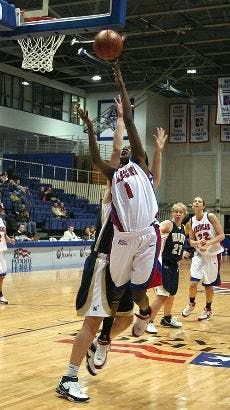 EAGLES SOAR - Senior Stephanie N'Garsanet soars to score against her Navy opponent in Wednesday night's game in Bender Arena. The Eagles took down the Midshipmen 69-37 in their final home game of the regular season to clinch a share of the PL crown. All o