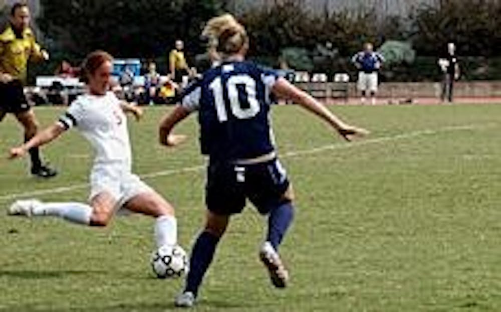 No. 5 Meg Runeari gets a leg up on Robert Morris on Sunday afternoon.