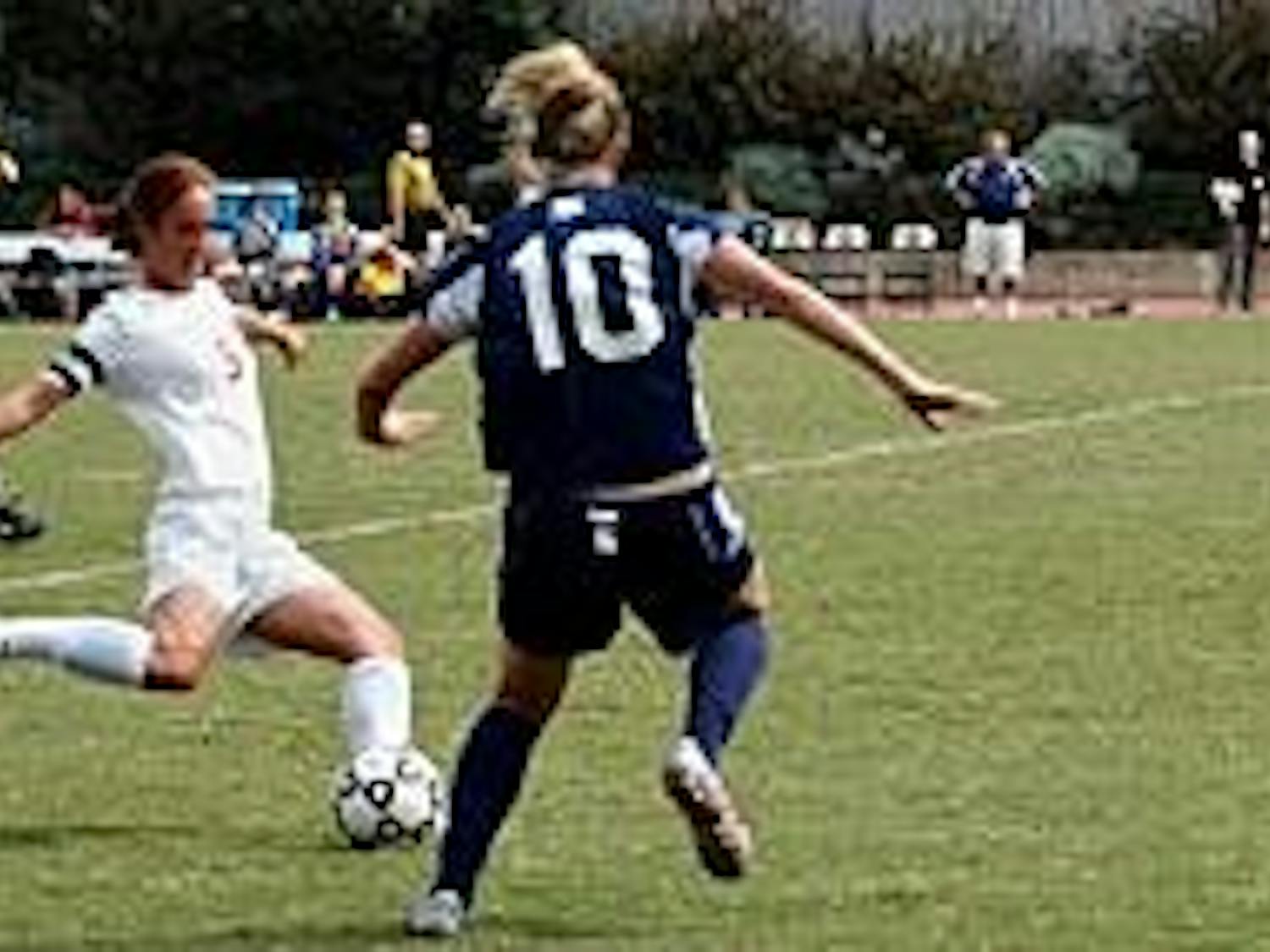 No. 5 Meg Runeari gets a leg up on Robert Morris on Sunday afternoon.