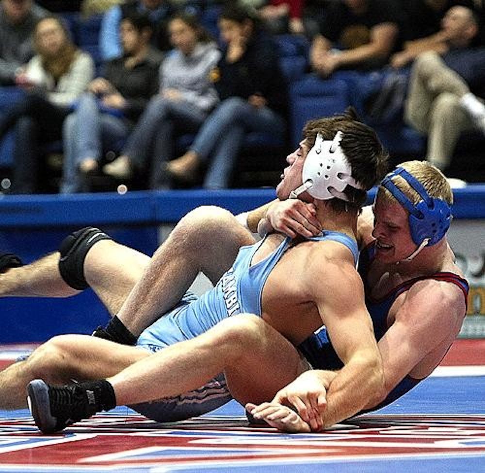 TAKE DOWN - No. 3 nationally ranked Mike Cannon, takes down his Columbia University opponent in the Eagles' Jan. 25 wrestling match. The Eagles won, and Cannon improved to 20-0 in the 174-pound weight class this season. 