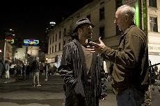 ROLE PLAY - Robert Downey Jr. is given a few tips by real-life journalist Steve Lopez on the set of "The Soloist," a film based on a series of columns written by Lopez about local violin virtuoso Nathaniel Anthony Ayers, played by Jaime Foxx. The film fai