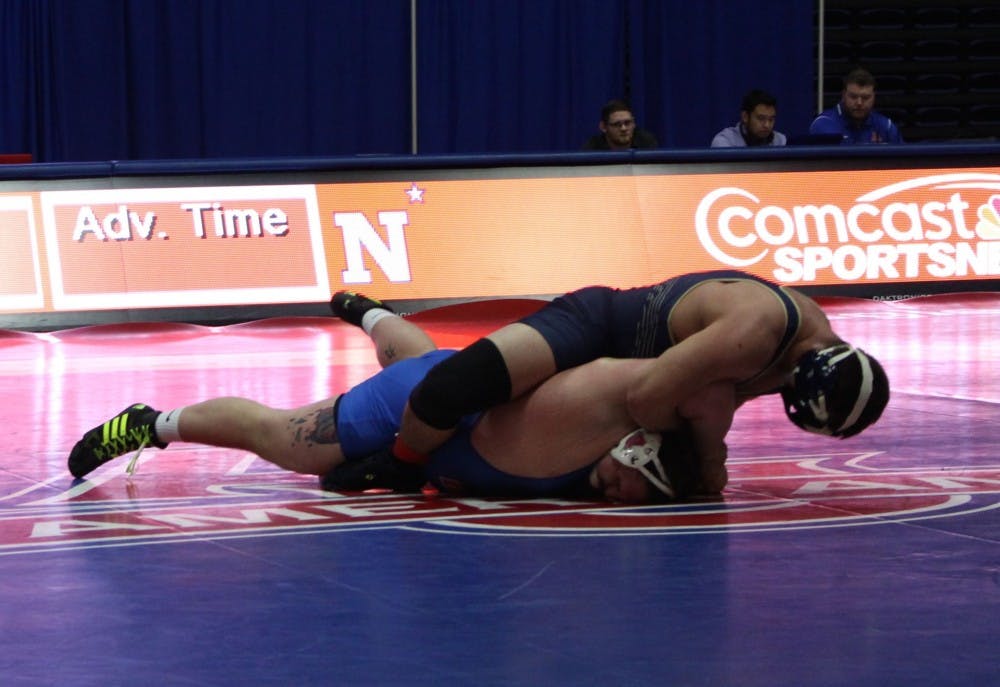 AU Freshman Jake Scanlan battles in the heavyweight match against Navy on Jan. 16