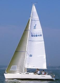 SAILING UP WIND - Adam Dexter trims the jib, Ben Burdett trims the main sail and Aaron Zankel drives the boat to third place. The sailing team worked together in five J105 races and finished with 20 total points. 