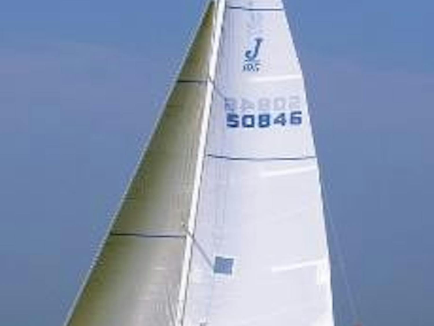 SAILING UP WIND - Adam Dexter trims the jib, Ben Burdett trims the main sail and Aaron Zankel drives the boat to third place. The sailing team worked together in five J105 races and finished with 20 total points.