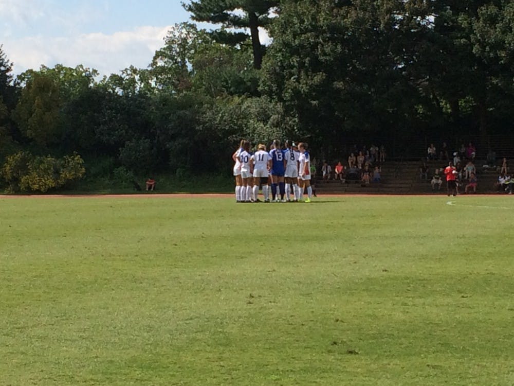 The AU women's soccer team huddles before their match against George Washington University on Sept. 3