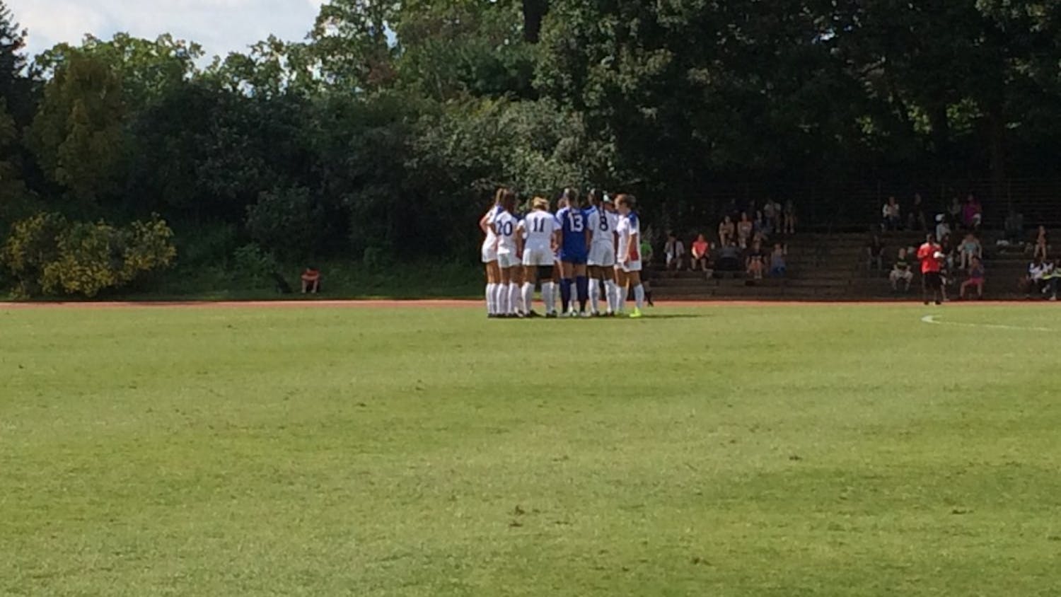 The AU women's soccer team huddles before their match against George Washington University on Sept. 3
