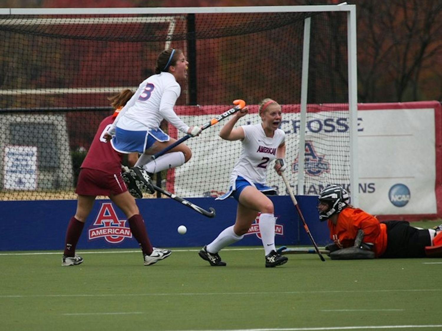 OH SO SWEET — Emily Stovicek and Rachel Carney celebrate their 2-1 win over Loch Haven University. The victory gives AU its set straight bid to the NCAA Tournament round of 16. They will face the University of Maryland on Saturday in College Park. AU fell to UMD 3-0 during the regular season.