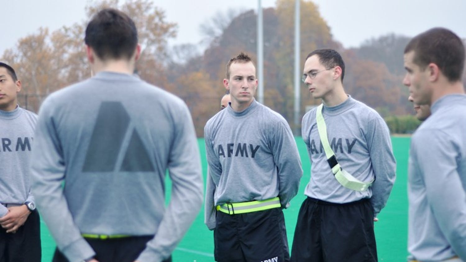 STANDING AT ATTENTION â€” ROTC cadets wait for instructions during their morning physical training at Georgetown University. This semester, AU cadets will be able to use fitness facilities here.  	