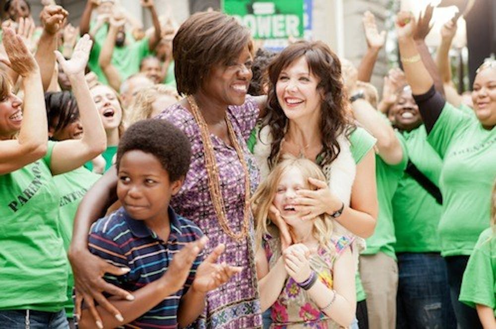 WBD-121  Nona Alberts (Viola Davis) and Jamie Fitzpatrick (Maggie Gyllenhaal) share a triumphant moment with Nona’s son Cody (Dante Brown) and Jamie’s daughter Malia (Emily Alyn Lind).