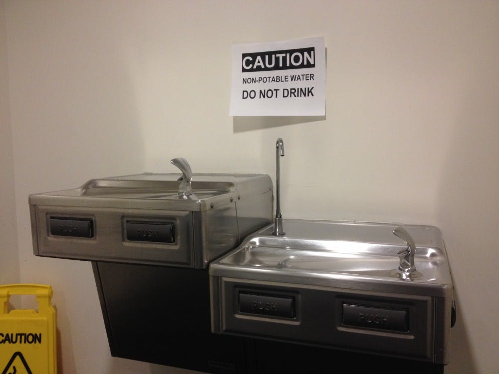 	AU officials posted a sign above water fountains in MGC cautioning people not to drink the water.