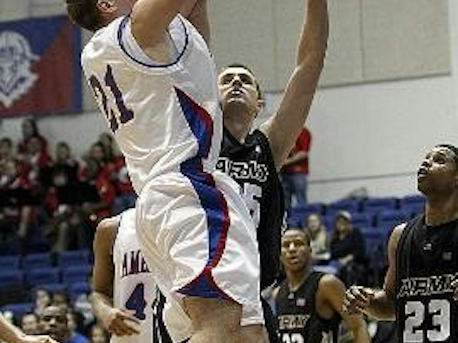 HIGH FLYING - Sophomore forward Nick Hendra rises up to score two of his game-high 14 points in last nights game against the U.S. Military Academy Black Knights. Hendra and the Eagles held Army to 34 points, the lowest opposition score on the season. The