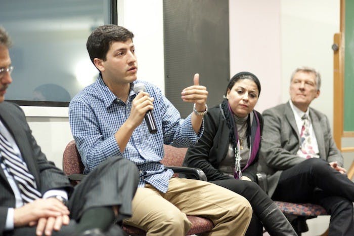 (from left) Larry Diamond, Robert Patino, Esraa Abdel Fattah and Ben Moses speak on a panel about â€œA Whisper to a Roar.â€