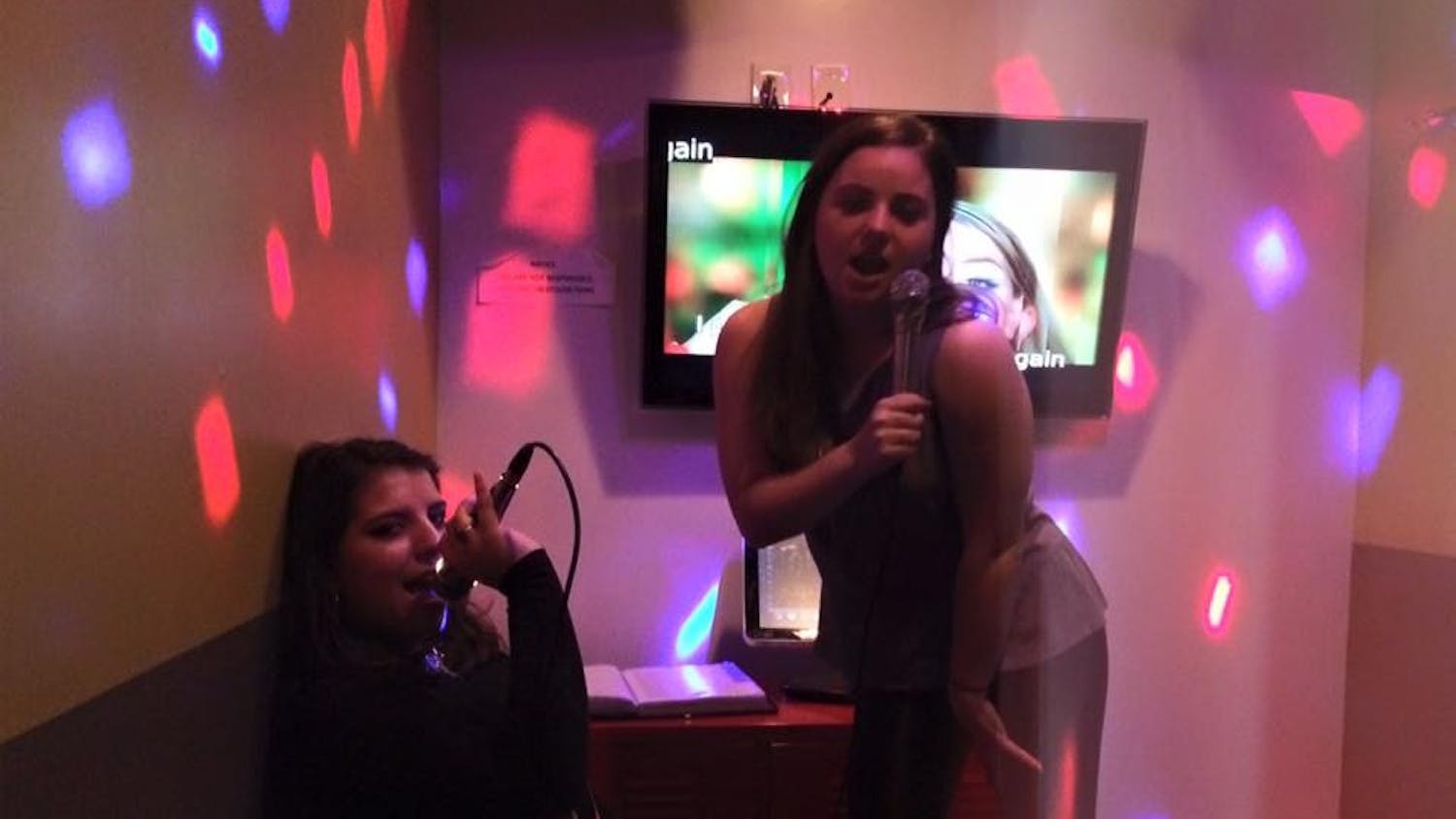 CAS senior Halle Edinboro, right, and me, proving our worth in a Muzette private karaoke room.