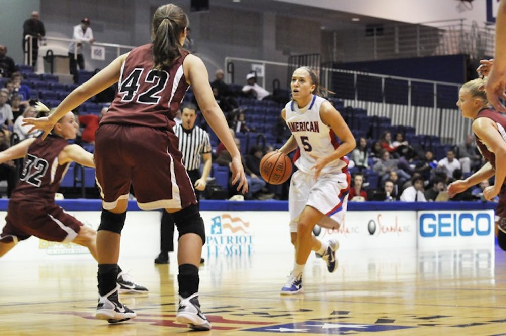 CONTROLLING THE TEMPO â€” Senior forward Michelle Kirk brings the ball up the court in Sundayâ€™s 73-47 exhibition win over Indiana University of Pennsylvania at Bender Arena. 