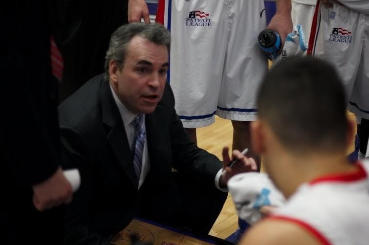 Brennan coaches his team during a game during the 2014-2015 season.