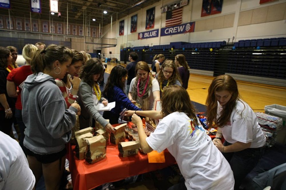 WIDE-AWAKE â€” Students stayed up all night in Bender Arena Tuesday to raise money for St. Jude Research Hospital. Participants ate free food, played games and contacted family members for donations. The event at AU was part of a national fundraiser for childhood cancer research. 