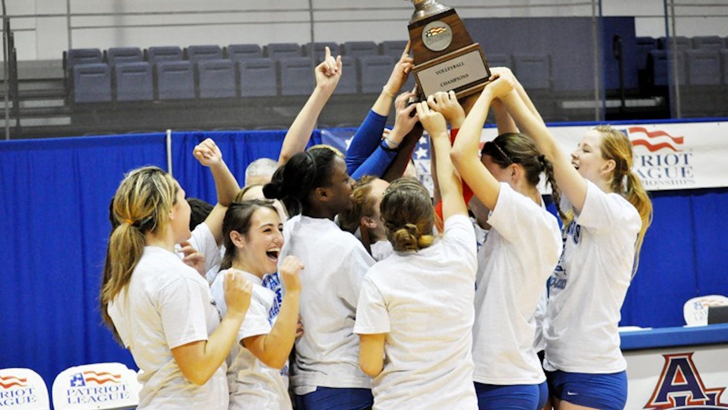 CHAMPS â€” The AU volleyball team raises the Patriot League Championship trophy after defeating Colgate University in straight sets on Sunday. The Eagles have now been crowned Patriot League Champions nine of the past 10 years.