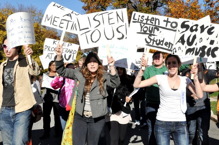 Barry Weinstein, Sofia Besosa, Paul Lysek and Madeline Winkler protest Wednesday the administration\'s decision to not award tenure to Jesus \"Manny\" Berard.