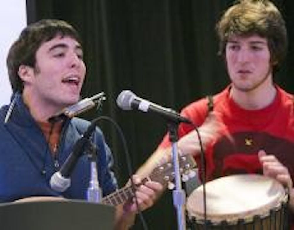 RAISING AWARENESS - Jeremy Cherson on the mandolin and Ryan DuBois on the drums perform in the Tavern Wednesday night at an open mic event during the International Speak Out AIDS Slam. This is one of many events to commemorate AIDS Awareness Week this wee