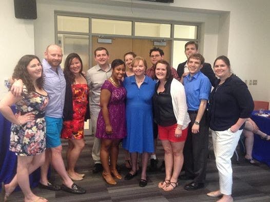 	Current Political Communication students surround former SOC professor Dotty Lynch.