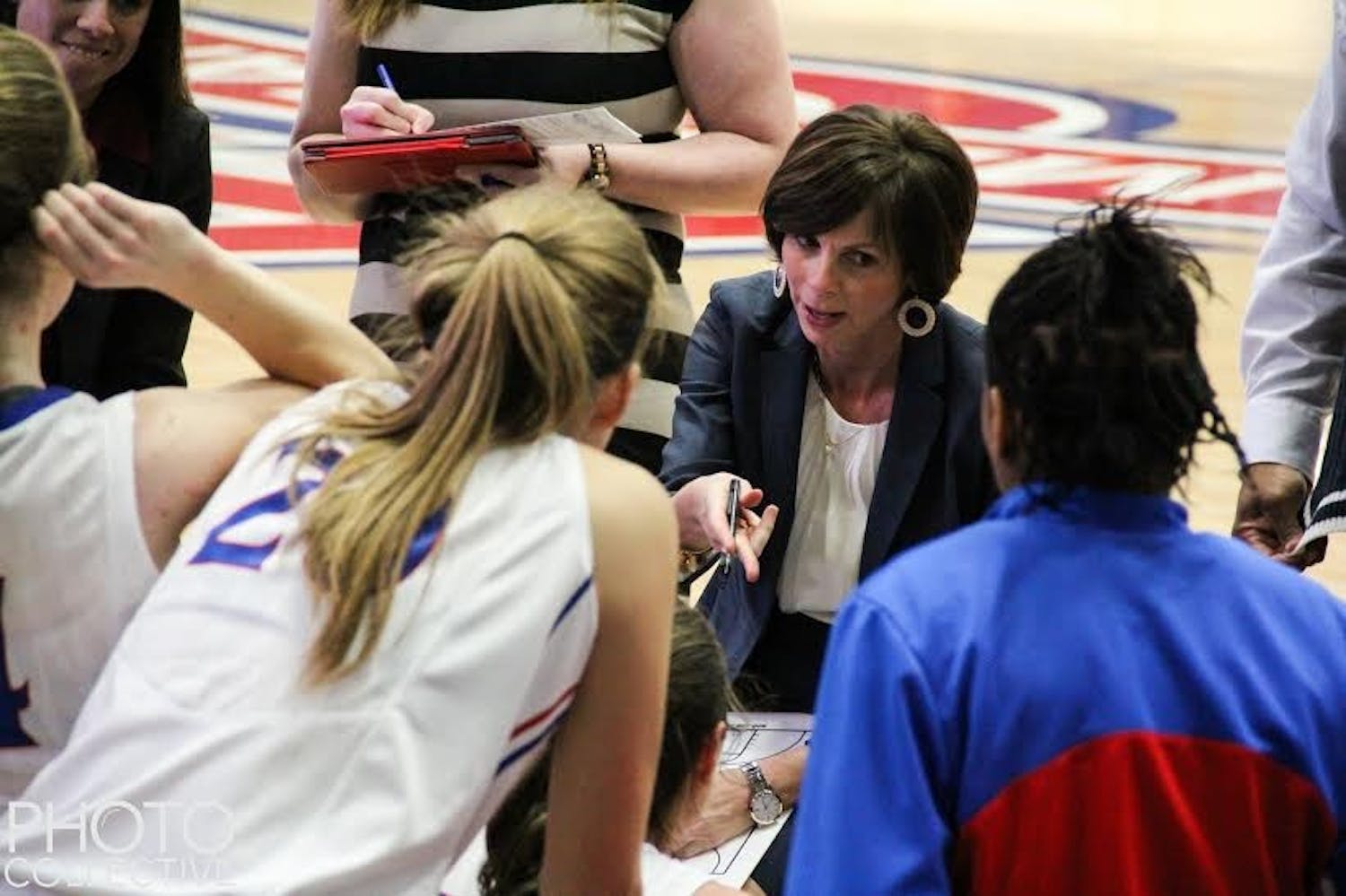 Photo Credit: Rosie Black/Photo Collective&nbsp;Head coach&nbsp;Megan Gebbia discusses game strategy&nbsp;with her team during a game last season. The Eagles will look to defend their conference title this year.&nbsp;