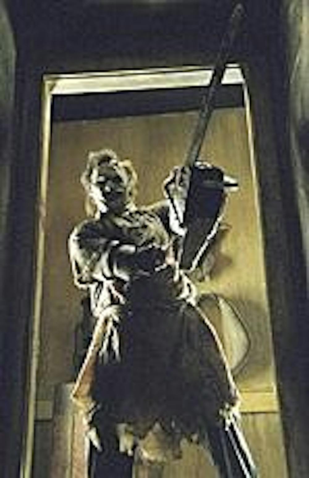Leatherface displays his favorite tool once again.