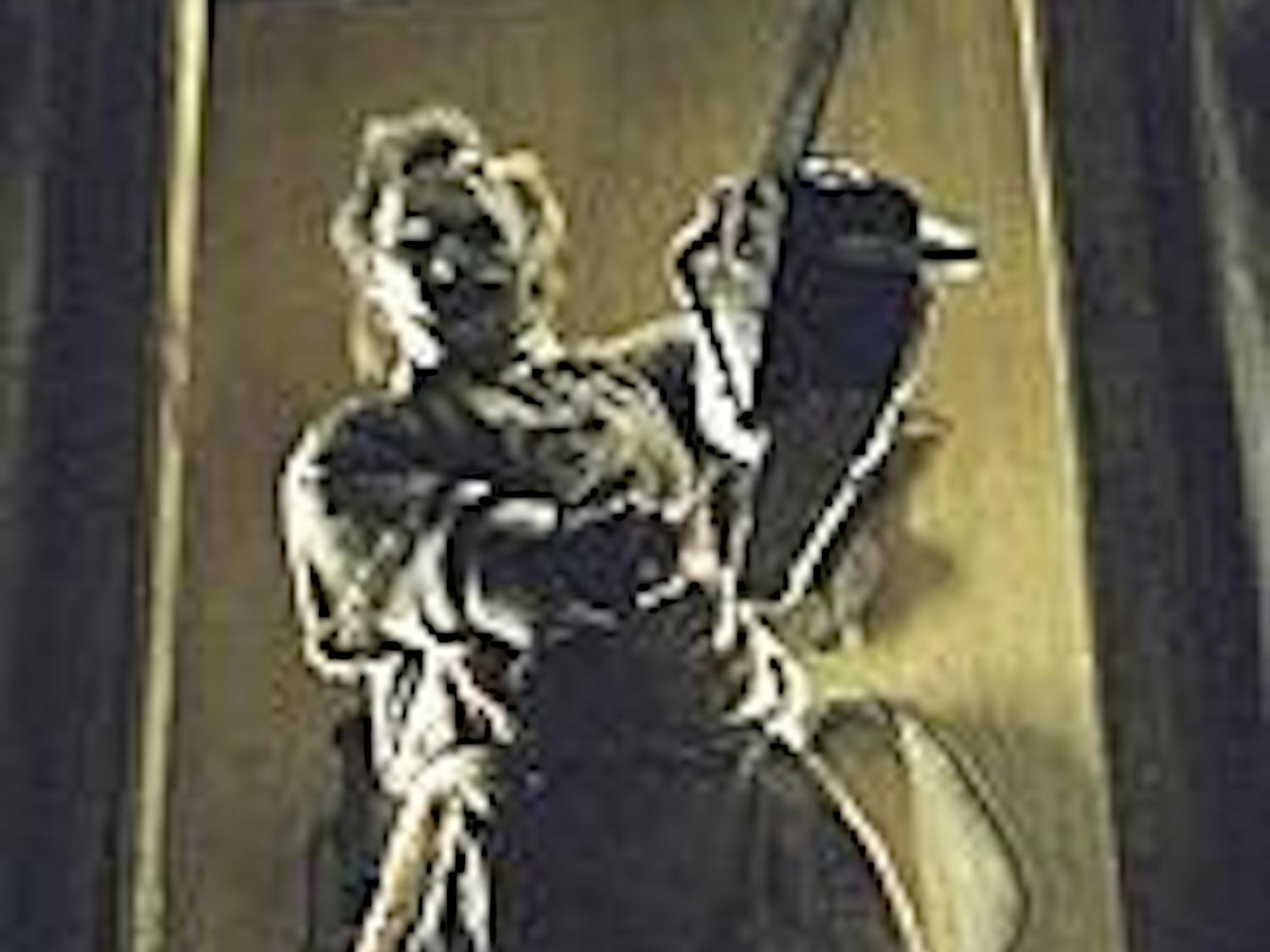 Leatherface displays his favorite tool once again.