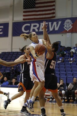 GIVING HER ALL â€” AUâ€™s Michelle Kirk drives the lane in a game earlier this season. Kirk was one of the many members of the AU athletic community that participated in National Girls and Women in Sports Day last Saturday. The event was intended to forward the awareness of women in the sports world.