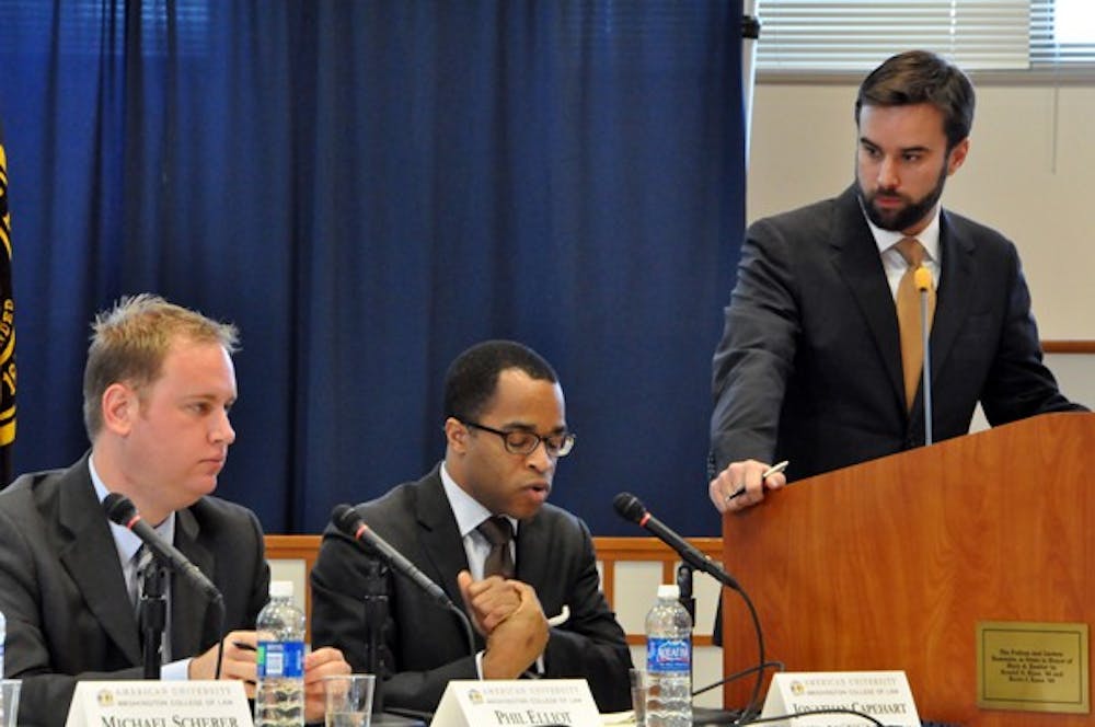 ARGUING OBAMA â€” Michael Scherer (standing right) moderated the panel Friday with Jonathan Capehart (right), Phil Elliott (middle), Christina Bellantoni (second left) and Bill Schneider (left).
