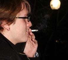 LOW BURN - Damien Chevaillier, a freshman in the School of International Service, smokes on the stairs in front of Mary Graydon Center. If the Undergraduate Senate passes new smoking restrictions, he would not be able to smoke at the entrances or exits of