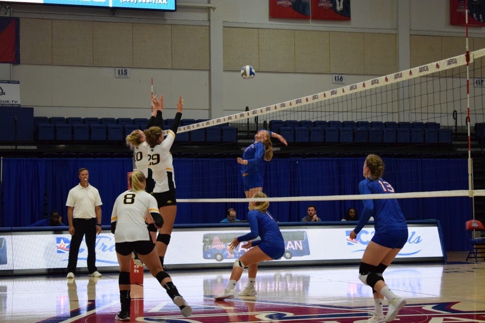 Sophomore outside hitter Shannon Webb goes up for a kill in the Eagles match against Iowa at the AU Volleyball Classic Sept. 16