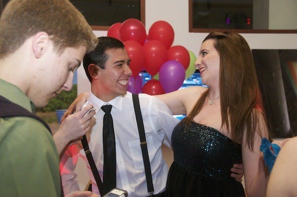 Glenn Weisinger of SOC and Hayat Abu-Ghazaleh of CAS enjoy RHAâ€™s Masquerave event in the SIS Atrium March 29. 