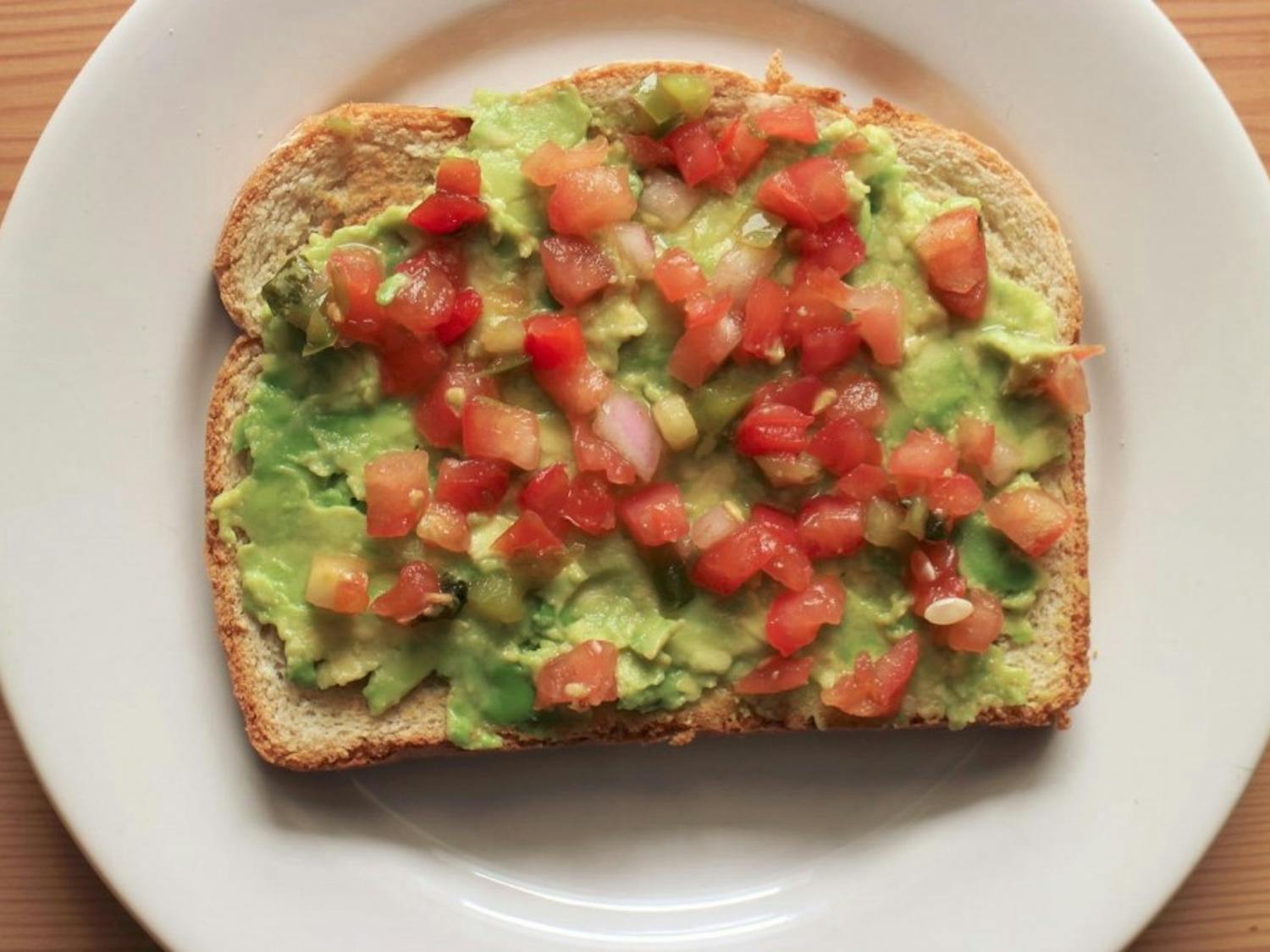 Avocado toast with tomatoes, feta and balsamic vinegar