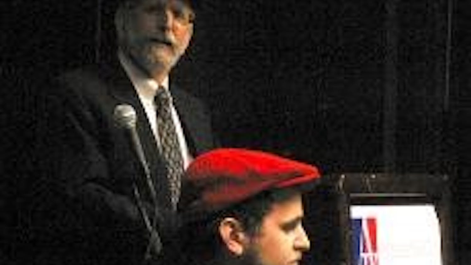 Maury Litwick, front, tours the country debating his father David, back.
