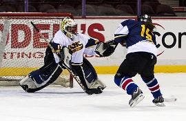 ROOMMATE BATTLE - Meredith Tomeo charges in on a breakaway against her roommate Emily Schulte in the recent DVCHC All-Star game for women's club ice hockey.  The game was held as part of an end-of-the-year celebration for the Eagles.  The team wrapped up 