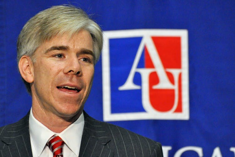 COMING HOME â€“ AU alumnus and host of NBCâ€™s â€œMeet the Press,â€ David Gregory, speaks at the new SIS building dedication Thursday. Gregory graduated from SIS in 1992. 