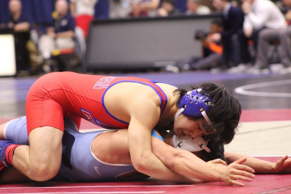 AU sophomore Josh Terao holds down Johnson Mai of Columbia in the second round of the EIWA conference tournament. Terao’s second place finish at the EIWA tournament earned him a bid to the NCAA tournament where he won one match and lost two.&nbsp;