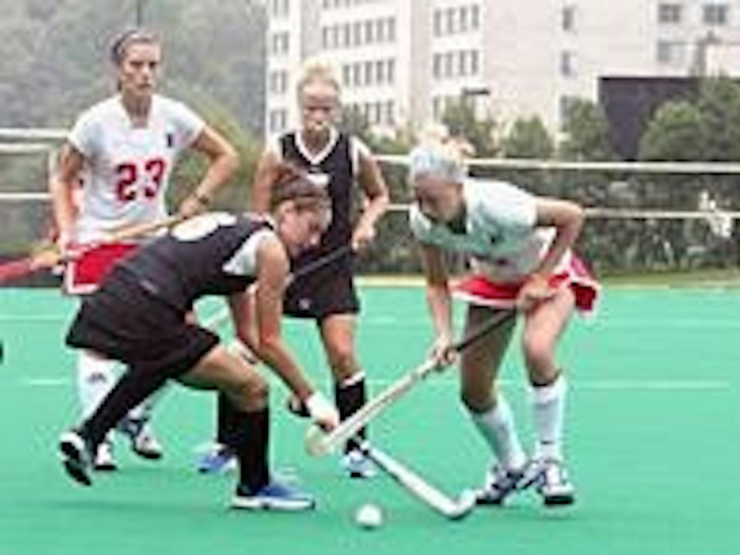No. 23 Denise Infante and No. 5 Carly Boyce batle it out against Towson.