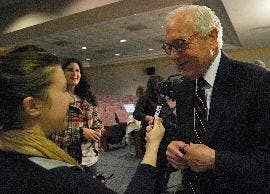 AMERICAN FORUM - "Face the Nation" host Bob Schieffer talks to Cate Minichino, a senior in the School of Communication (lower left), after the forum titled "Politics and Pundits: The Promises of the New Presidency and the Press." The event discussed the e