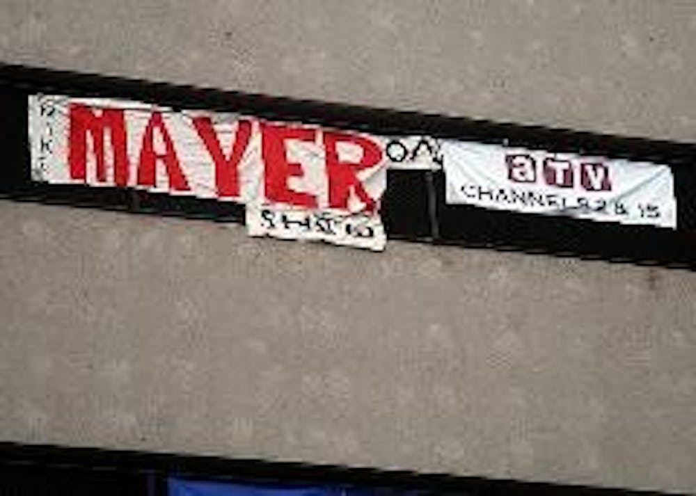 FLYING HIGH - A banner advertising the Mike Mayer Show hangs off the side of the Bender Arena parking garage. 