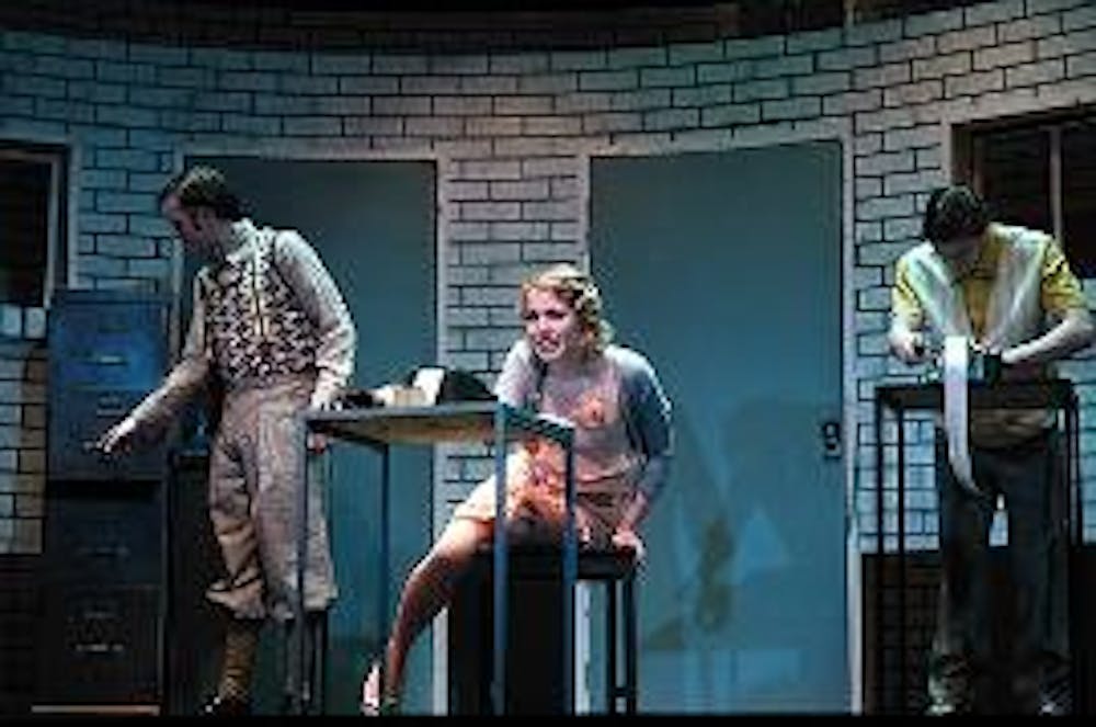 SHOCK VALUE - "Machinal" is a play about a young woman who is convicted of murder and consequently electrocuted. The play explores how new technology affects human relationships. Mechanized sound effects and dramatic shadows reinforce the solemnity of the