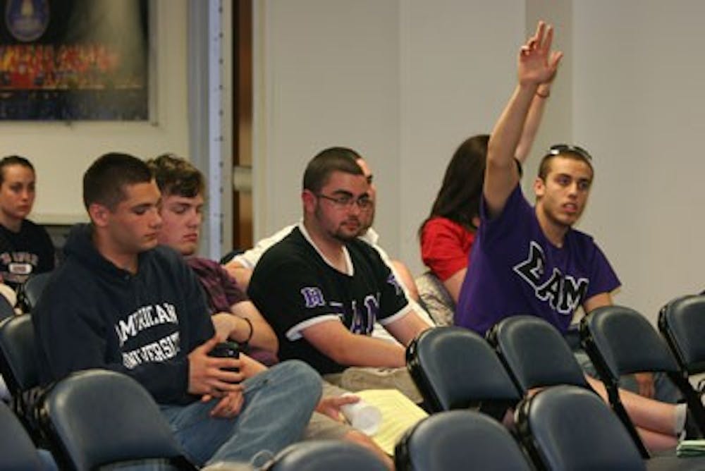 BEYOND THE BOUNDARIES â€” Concerned AU students ask questions during the Student Advocacy Center-sponsored panel on recent changes to the Student Conduct Code. The Code now allows AU to discipline students for off-campus behavior.