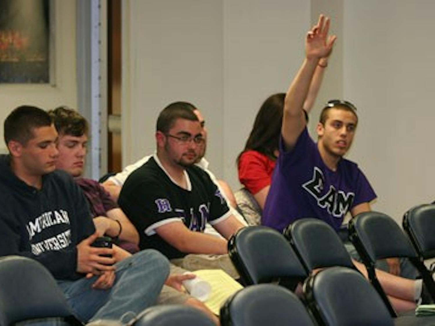BEYOND THE BOUNDARIES — Concerned AU students ask questions during the Student Advocacy Center-sponsored panel on recent changes to the Student Conduct Code. The Code now allows AU to discipline students for off-campus behavior.