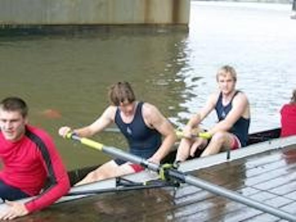 Above, from left to right, Ashton Rodgers, Michael Harold and Jason Obold dock after the men's heavyweight four race 