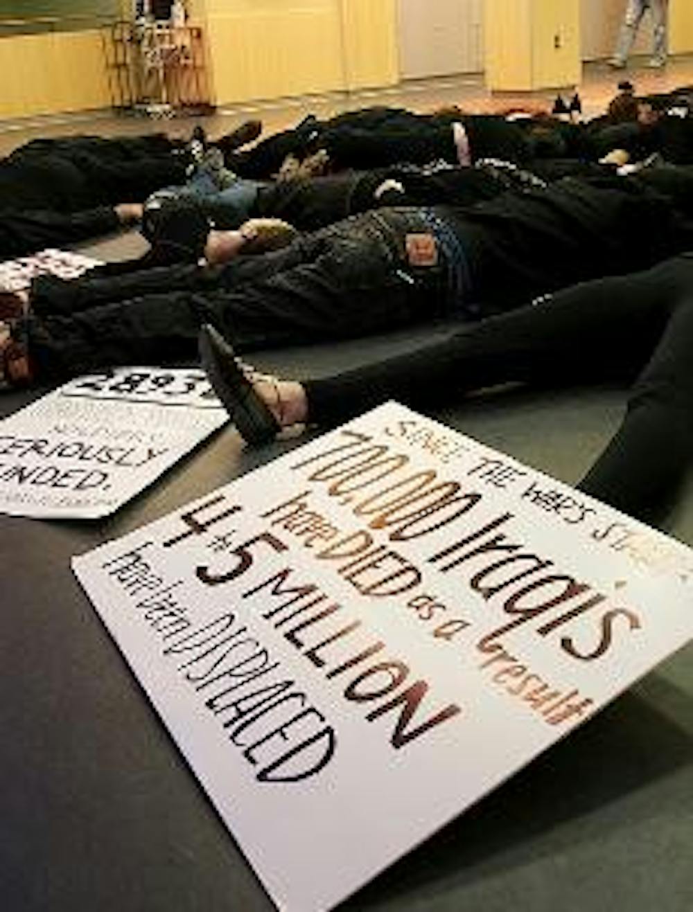 PROTESTING AN ANNIVERSARY - Members of the Community Action and Social Justice Coalition participated in a "die-in" yesterday to protest the fifth anniversary of the start of the Iraq war. 