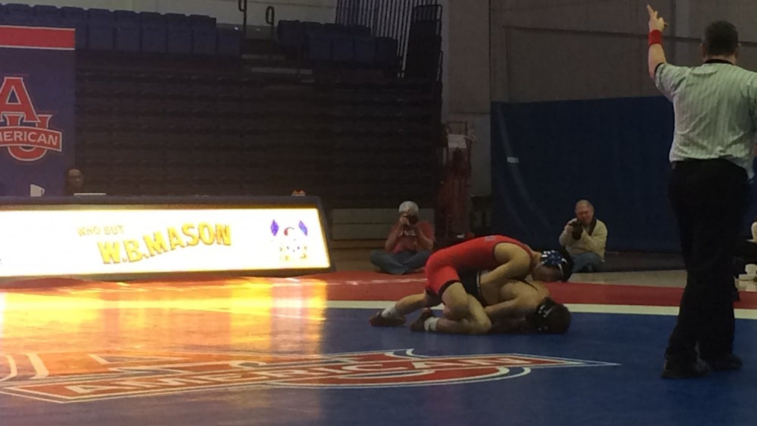 Redshirt junior Josh Terao (red) earns a 2-point takedown early in his match against Drexel's Austin DeSanto. 