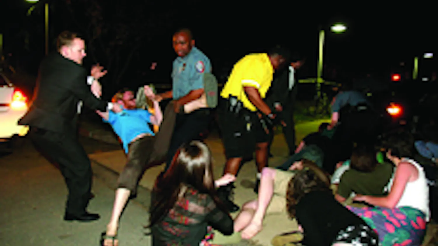 DELAYED CONSEQUENCES- SIx AU students were notified by the university Friday that they would be served with warrants for their arrests stemming from the April incident pictured above. At the time, 16 students attempted to block White House aide Karl Rove'